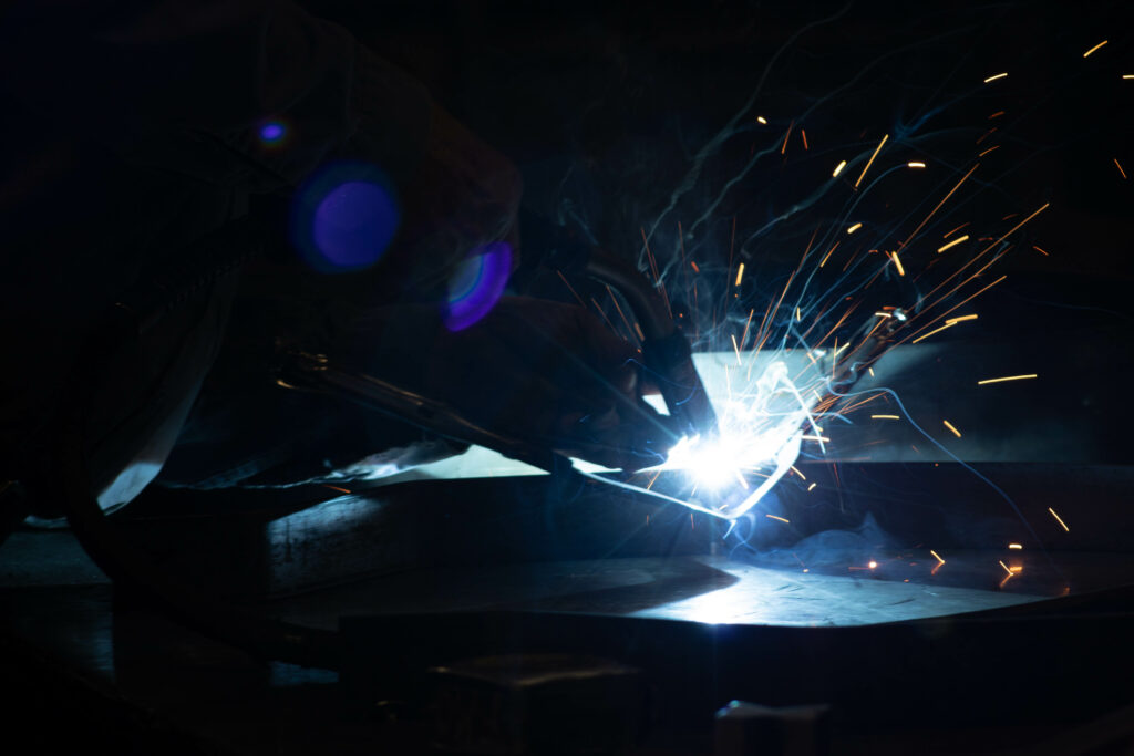 Up-close image of welding with sparks