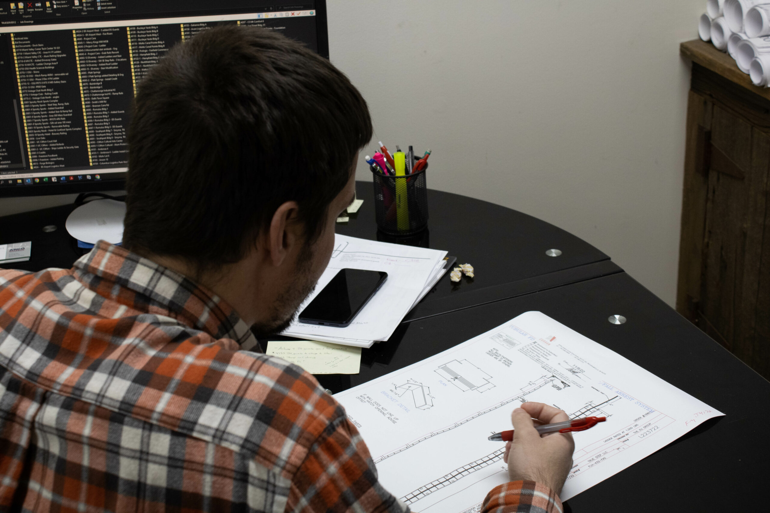 Project Manager examining drawings