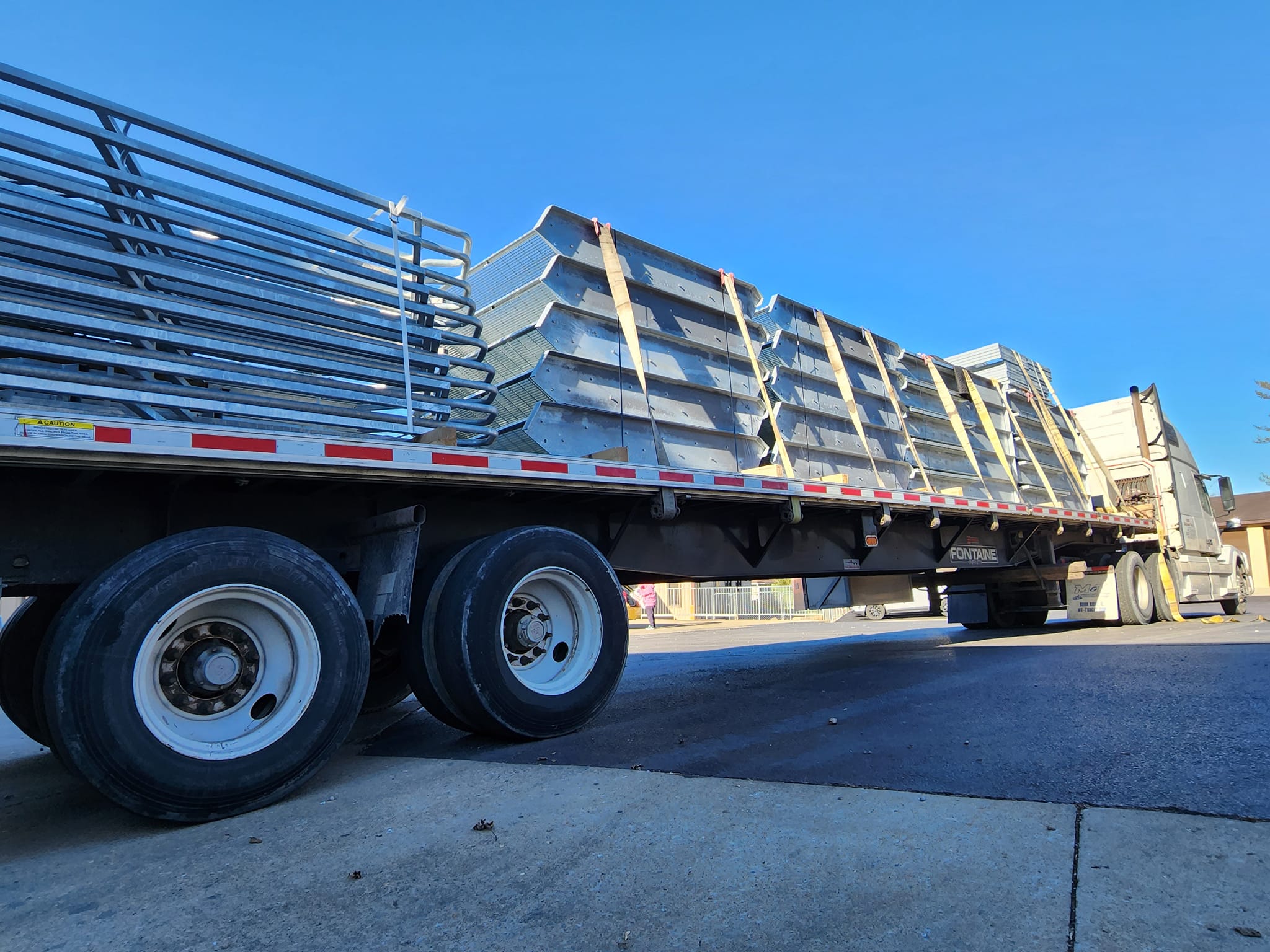 Truck loaded with galvanized dock stair components